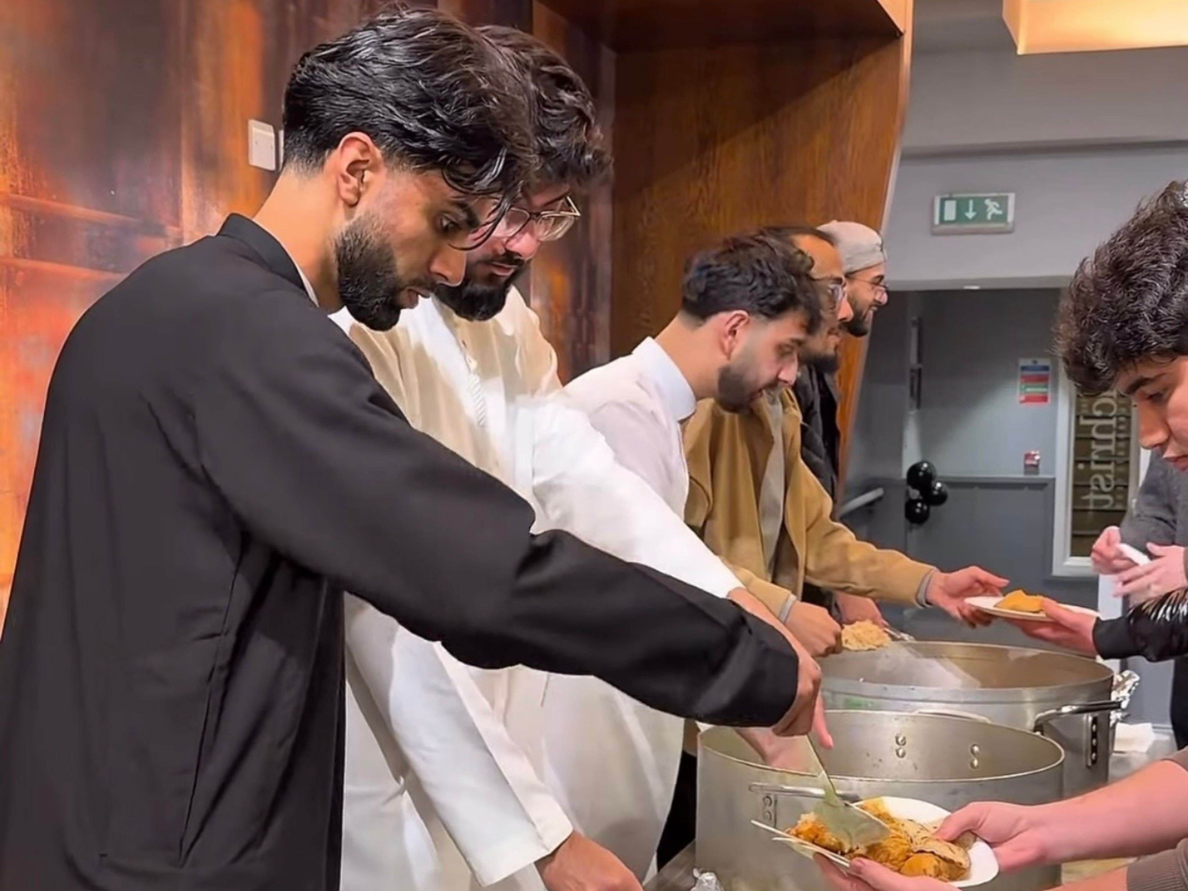 Students serving good at Muslim Students' Association Iftar meal during Ramadan.