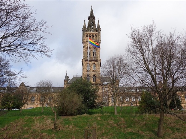 university of glasgow tower with pride flag flying