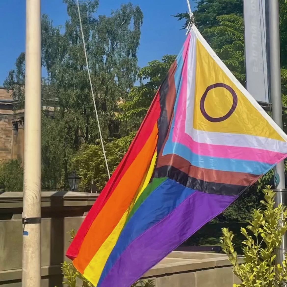 university of glasgow tower with pride flag flying